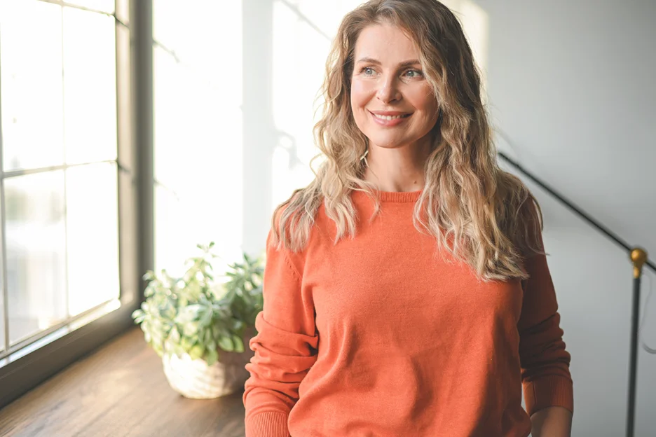 a portrait of a smiling, confident woman
