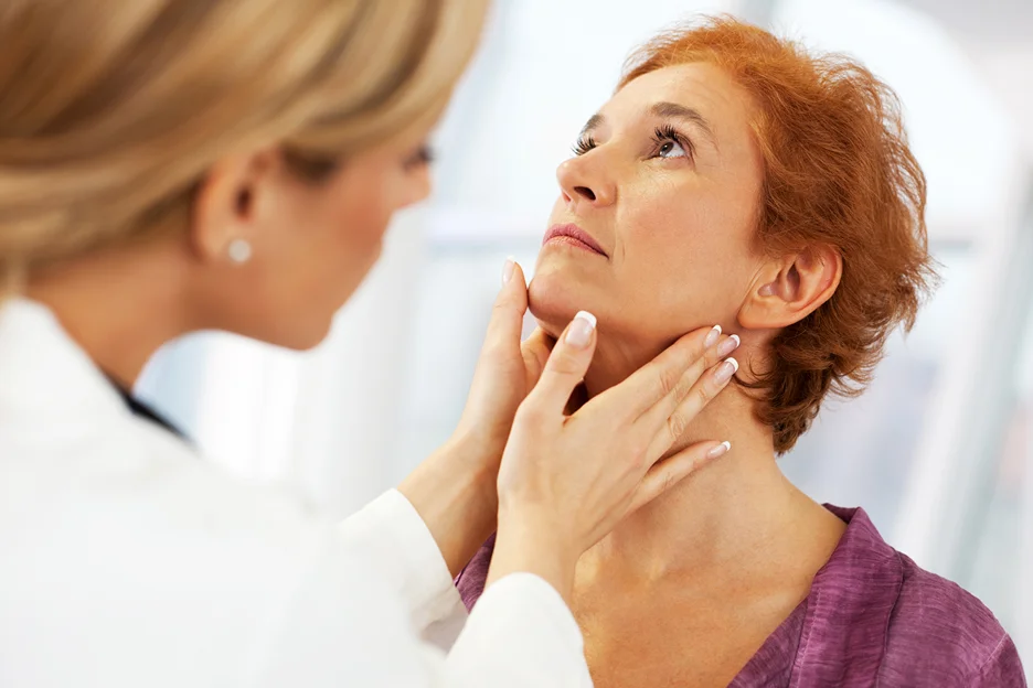the doctor checks the patient's jawline anatomy