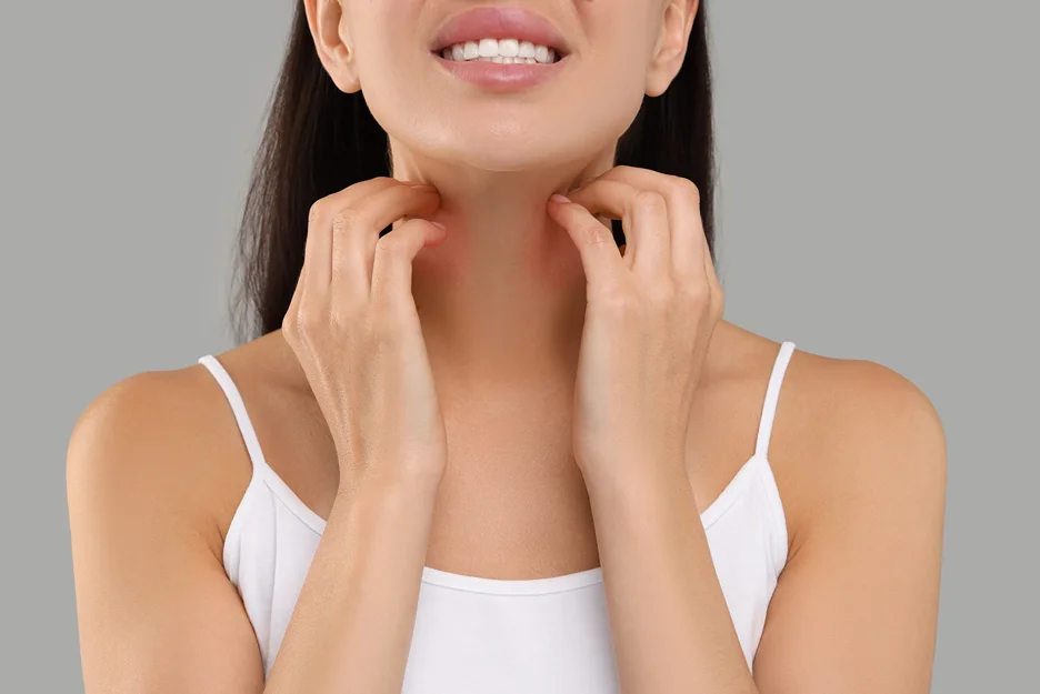A woman is touching her neck with her hands, possibly in search of a guide to alleviate neck bands or considering chin liposuction.