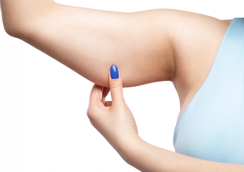A Woman Pinching Her Arm